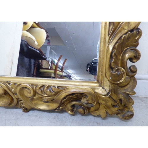 176 - A late 19thC gilt gesso framed, rococo design mirror&nbsp; 37