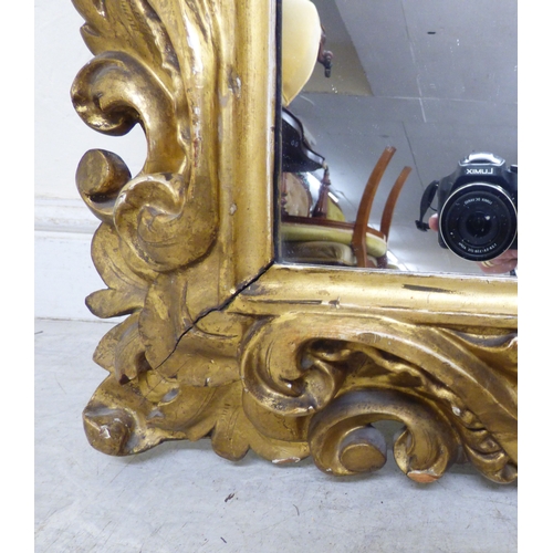 176 - A late 19thC gilt gesso framed, rococo design mirror&nbsp; 37