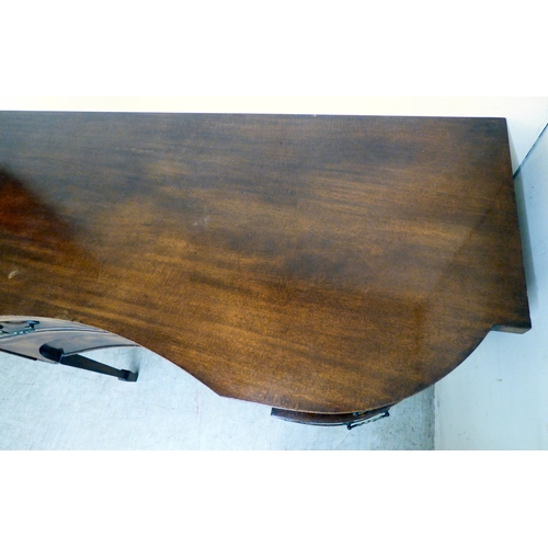 177 - A mid 20thC mahogany finished serpentine front sideboard, comprising an arrangement of drawers and c... 