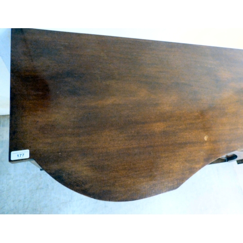 177 - A mid 20thC mahogany finished serpentine front sideboard, comprising an arrangement of drawers and c... 