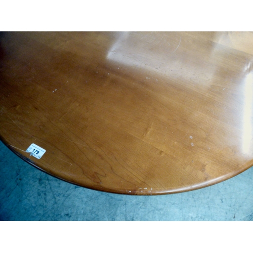 179 - A modern stained beech breakfast table, the top raised on a tripod base; and four matching chairs  3... 