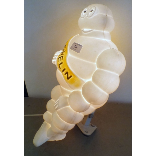 70 - A circa 1966 white plastic illuminating promotional model 'Michelin Man' on a wall bracket plinth  1... 