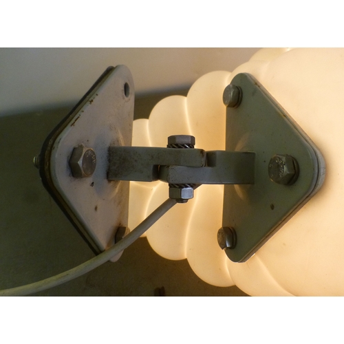 70 - A circa 1966 white plastic illuminating promotional model 'Michelin Man' on a wall bracket plinth  1... 