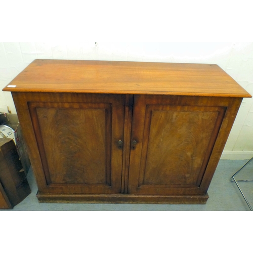82 - A mid 19thC and later mahogany cupboard with two doors and four shelves, raised on a plinth&nbsp; 36... 