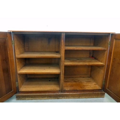 82 - A mid 19thC and later mahogany cupboard with two doors and four shelves, raised on a plinth&nbsp; 36... 