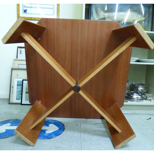 88 - A G-Plan teak framed coffee table with canted corners and tile top, raised on planked supports&nbsp;... 