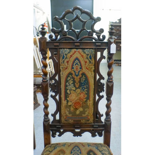 97 - A late Victorian mahogany framed tapestry upholstered nursing chair with carved decoration and barle... 