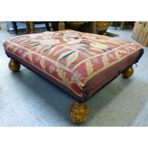 97 - A late Victorian mahogany framed tapestry upholstered nursing chair with carved decoration and barle... 