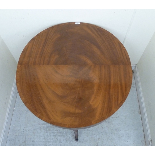 11 - A pair of modern Regency style mahogany finished demi-lune side tables, raised on sabre legs&nbsp; 3... 