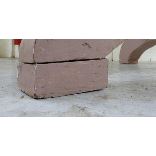 23 - A late 19th/early 20thC bleached mahogany centre table, the top raised on a grey painted pedestal an... 