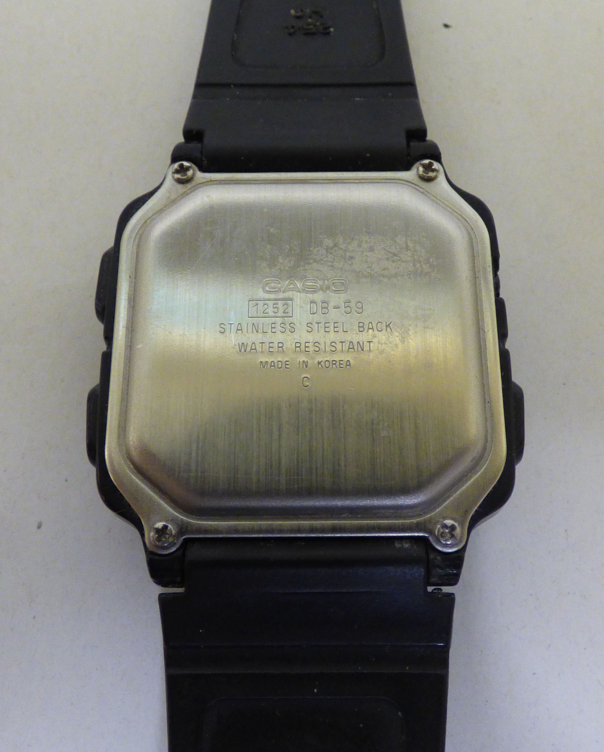 A Casio DB-59 digital wristwatch; and a Tissot Seastar wristwatch ...