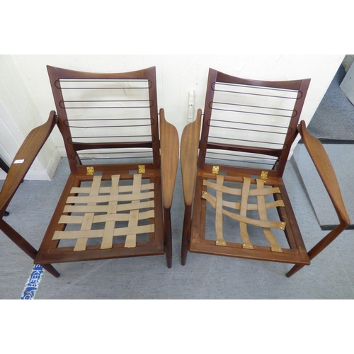 1 - A pair of IB Kofod-Larsen for G-Plan teak framed armchairs, the loose cushions upholstered in orange... 