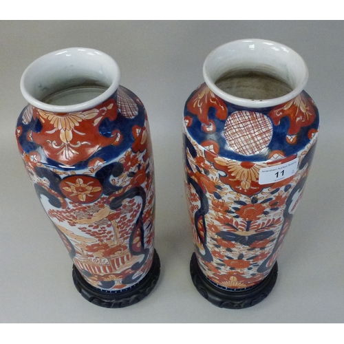 11 - A pair of Japanese Imari vases, decorated with flora&nbsp; each 13