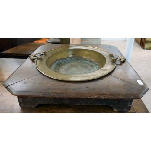 17 - A mid 19thC brazier table, the brass bowl with two handles and an oak frame with canted corners and ... 
