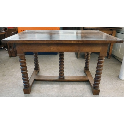 18 - A mid 19thC oak farmhouse style side table, the planked top over two opposing drawers, raised on bob... 