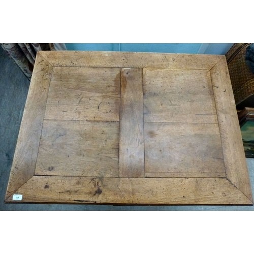 19 - A mid/late 19thC oak farmhouse style dropleaf table, raised on square, tapered legs, united by a cro... 