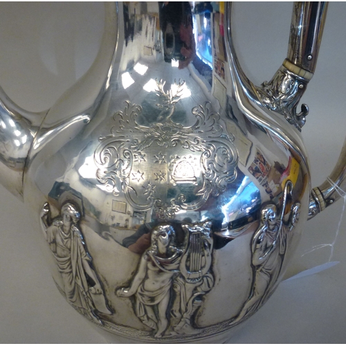 2 - An early Victorian silver hotwater jug, embossed in relief with five classical figures  London 1842 ... 