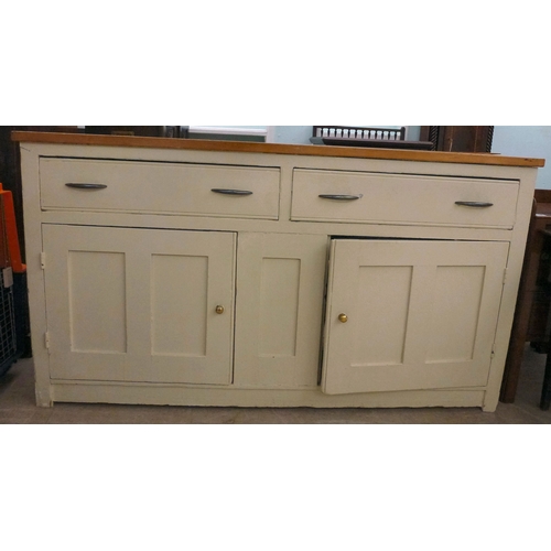 20 - A late 19thC and later cream painted wooden sideboard, the showwood pine surface over two drawers/tw... 
