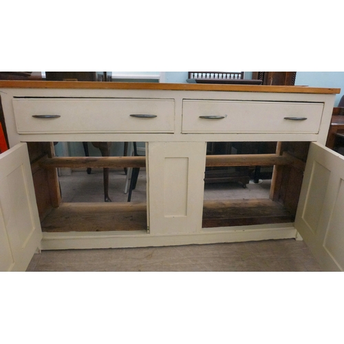 20 - A late 19thC and later cream painted wooden sideboard, the showwood pine surface over two drawers/tw... 