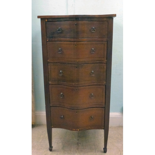 22 - An early 20thC string inlaid mahogany serpentine front chest of drawers, raised on tapered legs and ... 