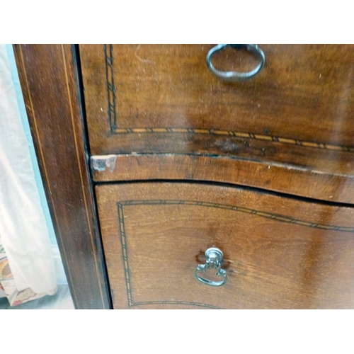 22 - An early 20thC string inlaid mahogany serpentine front chest of drawers, raised on tapered legs and ... 
