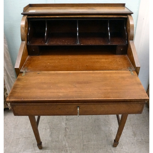 24 - An early 20thC string inlaid walnut finished roll top writing desk with a part-fitted interior, rais... 