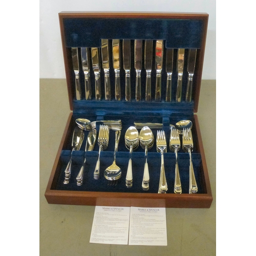 242 - A Marks & Spencer stainless steel, eight place setting canteen of cutlery, in a fitted mahogany ... 