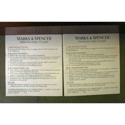 242 - A Marks & Spencer stainless steel, eight place setting canteen of cutlery, in a fitted mahogany ... 