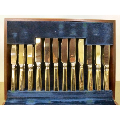 242 - A Marks & Spencer stainless steel, eight place setting canteen of cutlery, in a fitted mahogany ... 