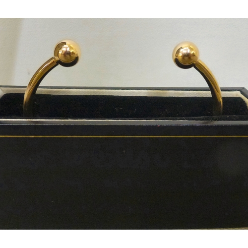 249 - A 9ct gold torque bracelet  boxed (approx. 12.2grms)