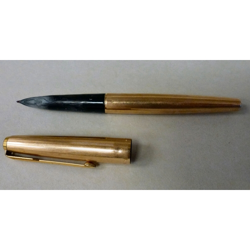 260 - A mixed lot: to include a Parker 61 gold plated fountain pen; items of personal ornament; and an 'Ac... 