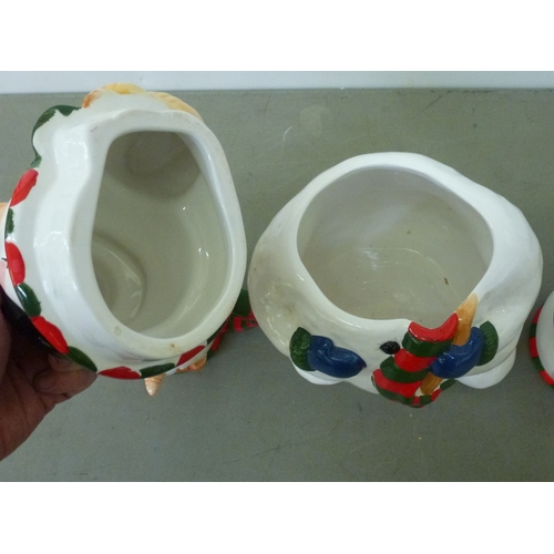 262 - A novelty china lidded cookie jar, fashioned as a snowman; and two mugs