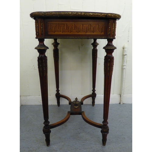 293 - An early 20thC French style marquetry and string inlaid mahogany writing table, the hinged lid profu... 