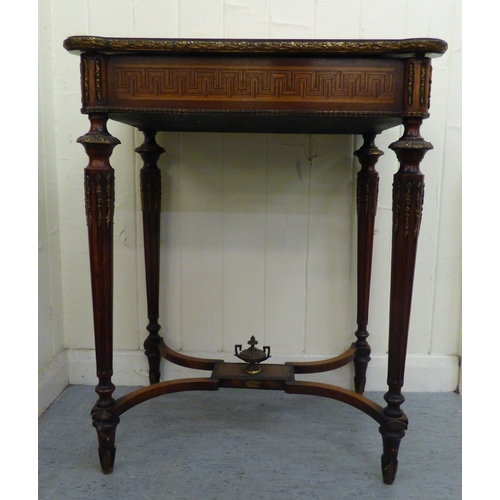 293 - An early 20thC French style marquetry and string inlaid mahogany writing table, the hinged lid profu... 