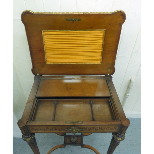 293 - An early 20thC French style marquetry and string inlaid mahogany writing table, the hinged lid profu... 