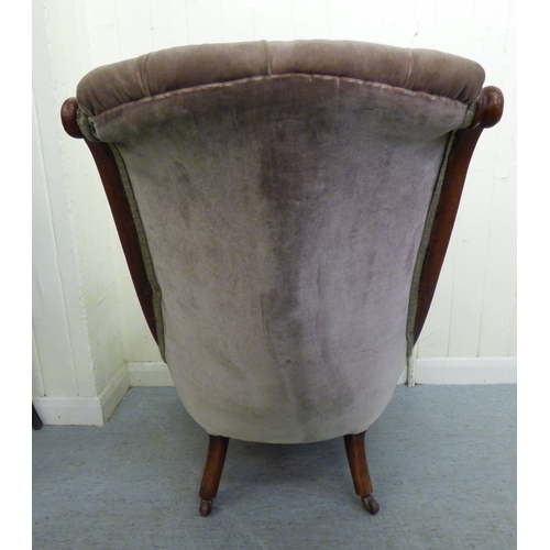 294 - A mid/late Victorian mahogany showwood framed library chair, button upholstered in green fabric, rai... 