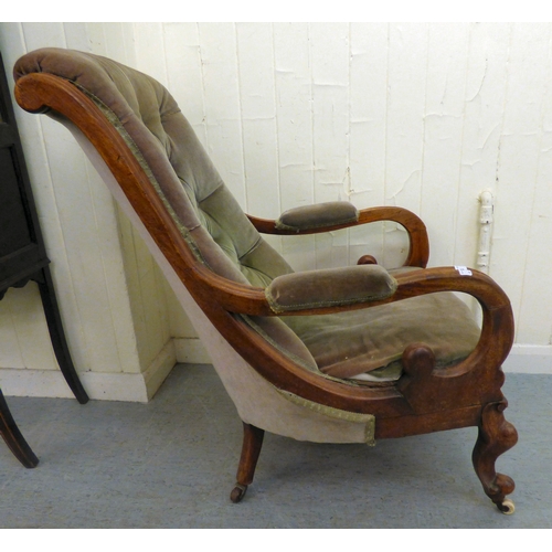 294 - A mid/late Victorian mahogany showwood framed library chair, button upholstered in green fabric, rai... 