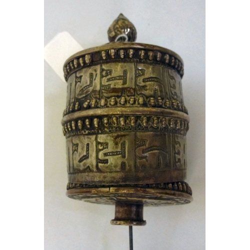 5 - A white metal Tibetan Buddhist prayer wheel, on a turned wooden handle