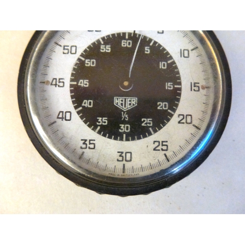 54 - A Heuer black plastic cased stop watch