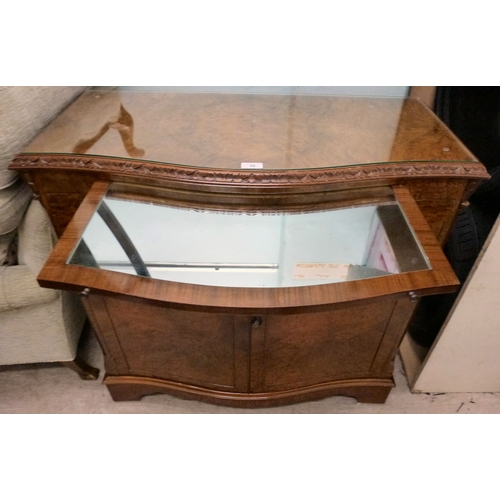 56 - A modern walnut finished serpentine front side cabinet with two doors, raised on bracket feet&nbsp; ... 