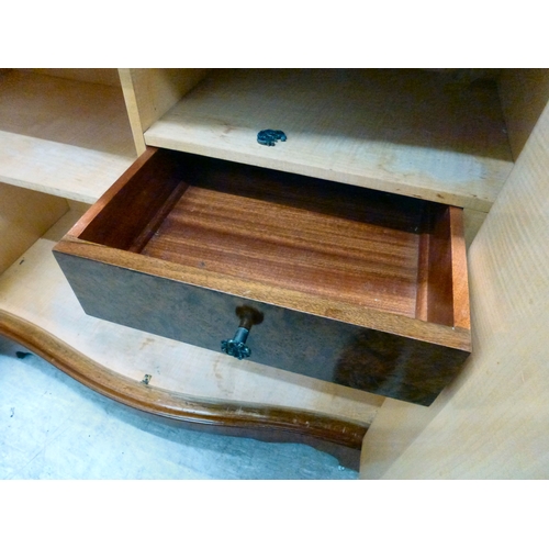 56 - A modern walnut finished serpentine front side cabinet with two doors, raised on bracket feet&nbsp; ... 