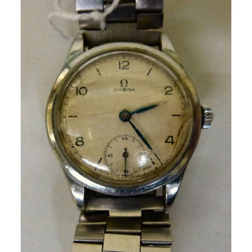 8 - A 1950s/60s Omega stainless steel cased and strapped wristwatch, faced by an Arabic and baton dial w... 
