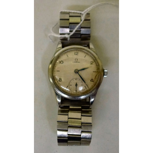 8 - A 1950s/60s Omega stainless steel cased and strapped wristwatch, faced by an Arabic and baton dial w... 