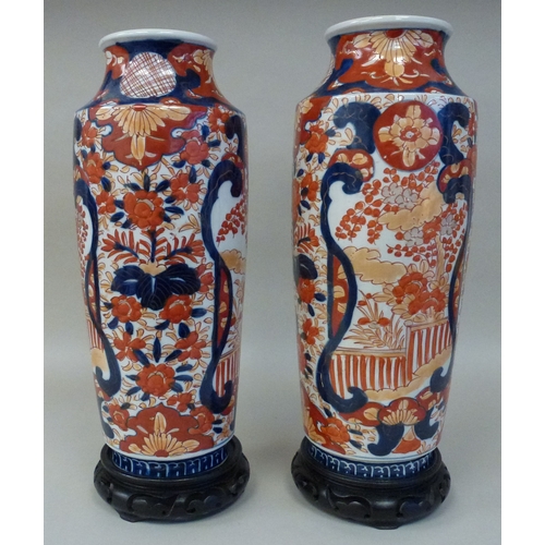 11 - A pair of Japanese Imari vases, decorated with flora&nbsp; each 13