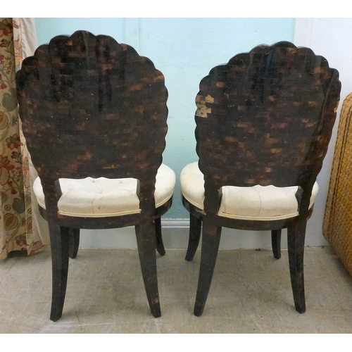 16 - A pair of modern brass inlaid, faux tortoiseshell veneered chairs, the backs of shell design, uphols... 
