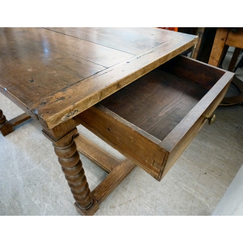 18 - A mid 19thC oak farmhouse style side table, the planked top over two opposing drawers, raised on bob... 