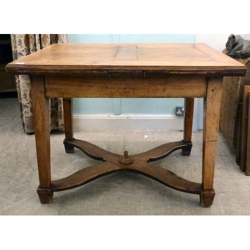19 - A mid/late 19thC oak farmhouse style dropleaf table, raised on square, tapered legs, united by a cro... 