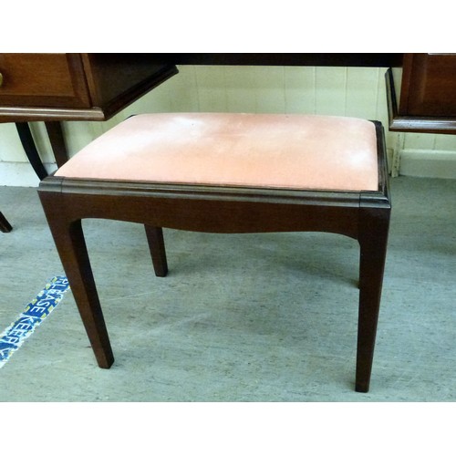 300 - A Stag mahogany dressing table with a raised, mirrored back, over five drawers, raised on square leg... 