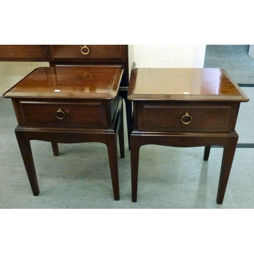 300 - A Stag mahogany dressing table with a raised, mirrored back, over five drawers, raised on square leg... 