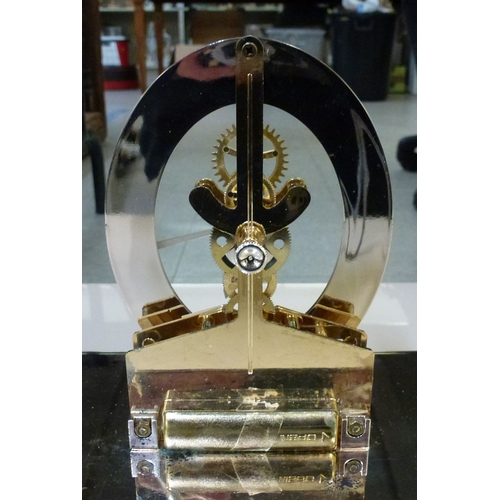 Clocks: to include a Howard Miller perspex pyramid design example ...